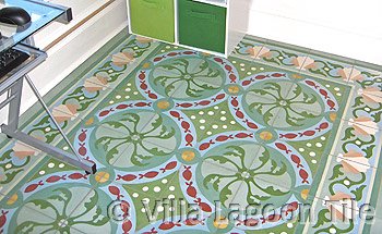 Cement tile floor with shells and fish