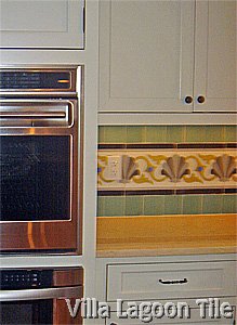 Kitchen photo with cement mosaic backsplash