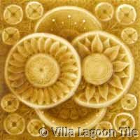 yellow glazed ceramic tile in relief pattern