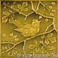 Antique bird tile in yellow green glaze
