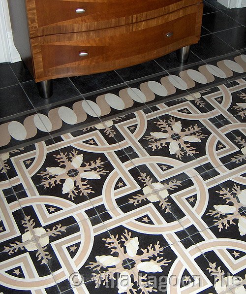 Villa Lagoon Tile's exclusive "Trapani Midnight" cement tile, installed on a bedroom floor.