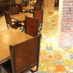 The dining room of the Flying Iguana, with a good view of the patchwork cement tile used as flooring.