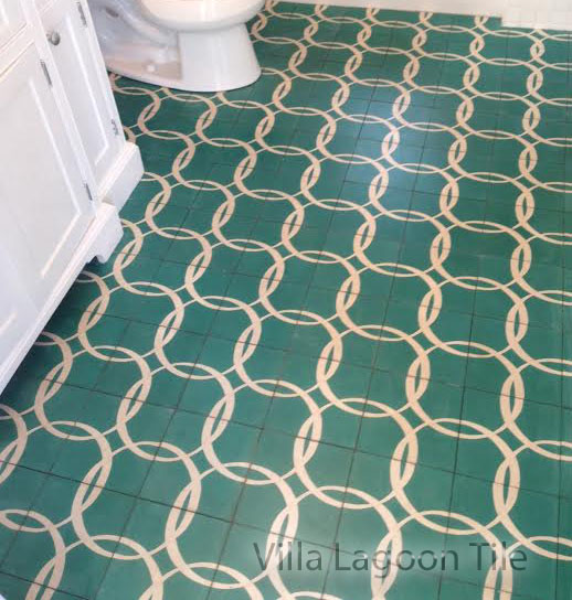 A custom cement tile floor, from Villa Lagoon Tile, in a Bahamian white bathroom.