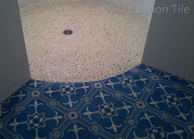 A beautiful transition from Villa Lagoon Tile's cement tile to a shower floor in the Bahamas.