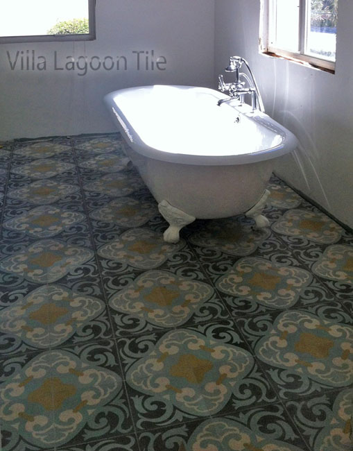 La Espanola cement tile from Villa Lagoon Tile, with a clawfoot tub, in a white bathroom.
