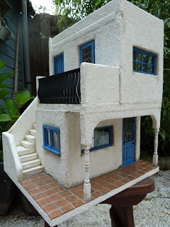 A miniature home, with reproduced Villa Lagoon Tile.