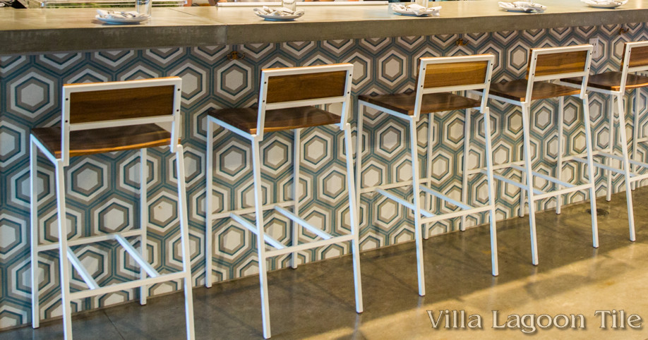 Front of bar tiled with our concentric hex cement tile.
