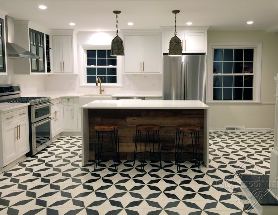 Simple and bold black and white cement tile kitchen floor.