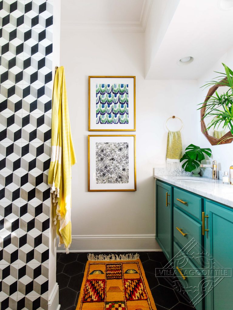 Black hexagonal shaped cement tile floor and classic cube cement tile pattern on the wall create a fun modern bathroom.