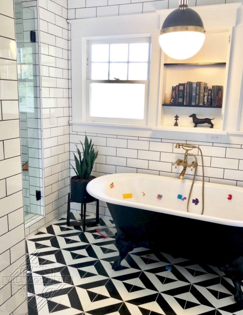 Geometric cement tile pattern in a basic diagonal stripe creates a bold bathroom floor.
