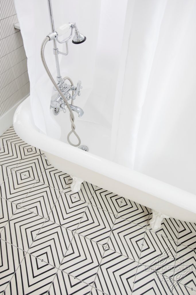 Modern black and white maze pattern cement tile floor.