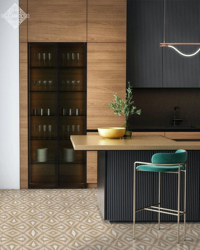 A modern-looking kitchen with tile floor. There is an island in the middle of the room with a chair.