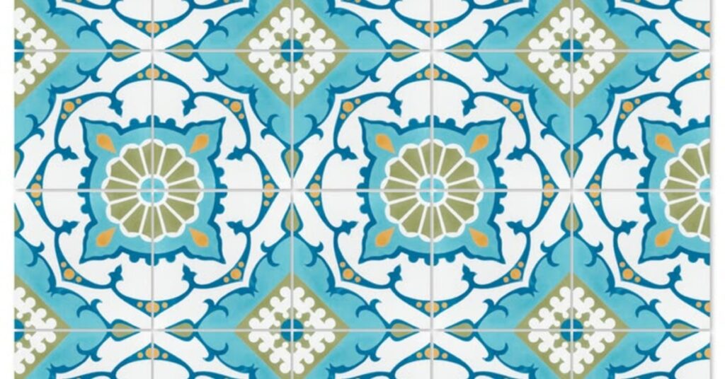 A tile design using the colors blue, white, and green. There are small splashes of orange throughout.