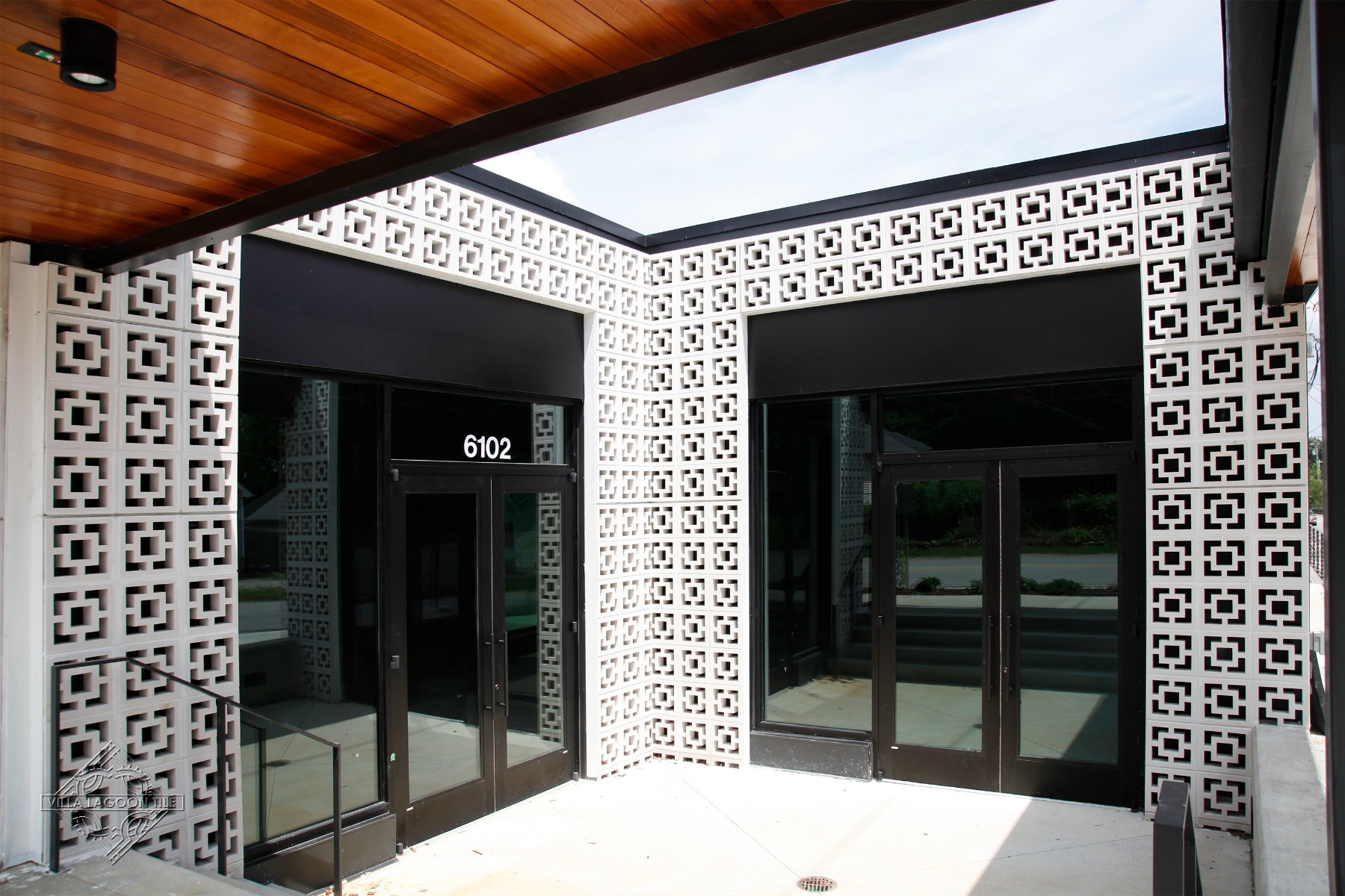 Modern Architectural Entryway with Large Tonga Breeze Block Surround