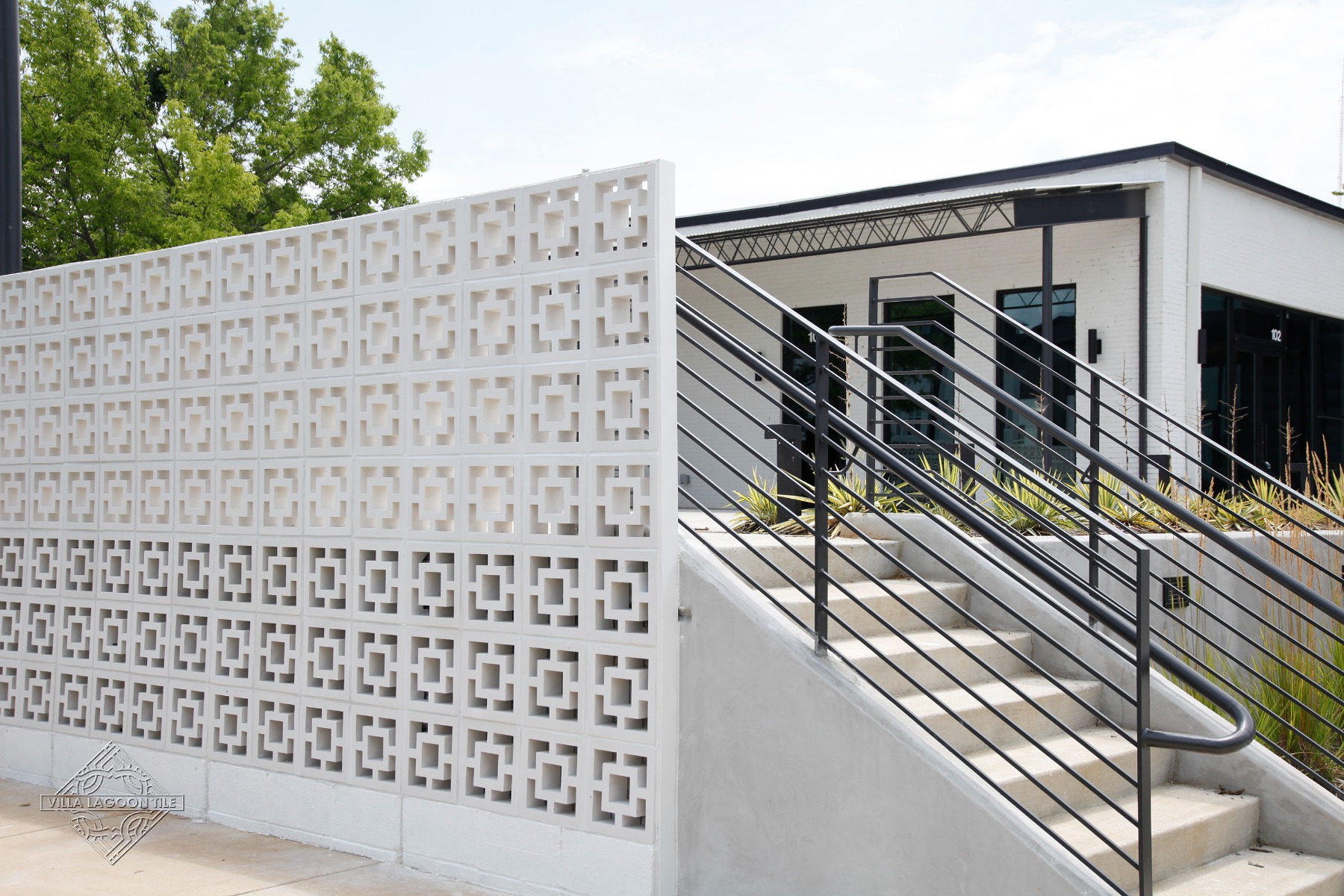 Modern Concrete Staircase with Large Tonga Breeze Block Privacy Screen in Nashville