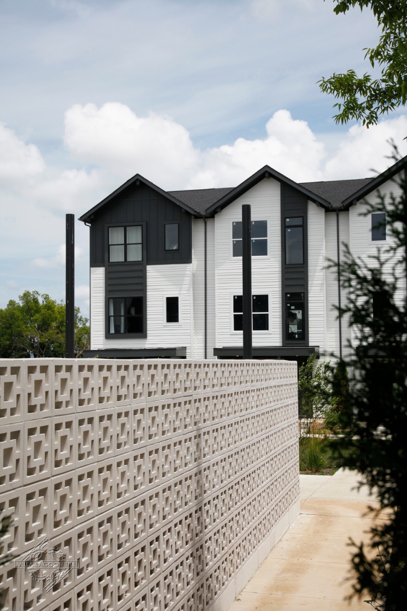 Large Tonga Breeze Block Screen Wall Leading to Modern Nashville Townhomes
