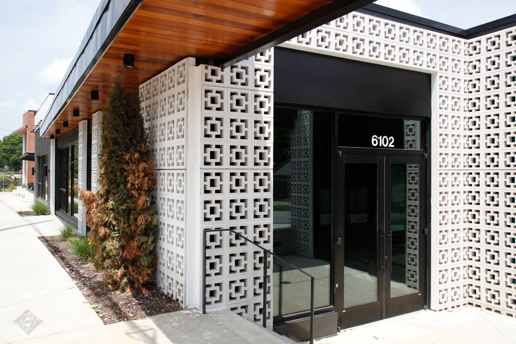 Modern Retail Entrance at 6102 Robertson Road featuring Large Tonga Breeze Blocks