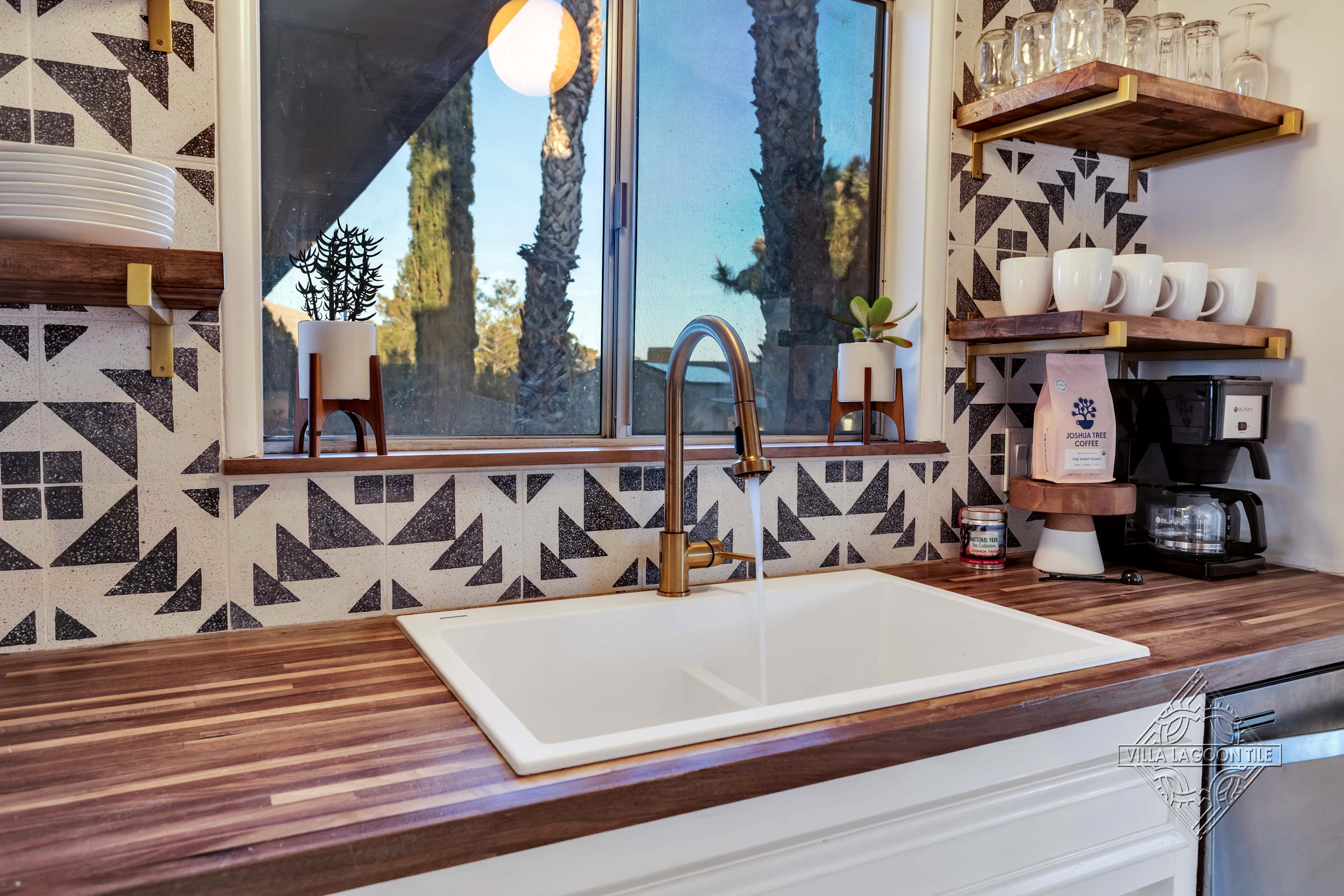 Bold Geometric Kitchen Backsplash Featuring Code Talker Terrazzo and Signature Hardware