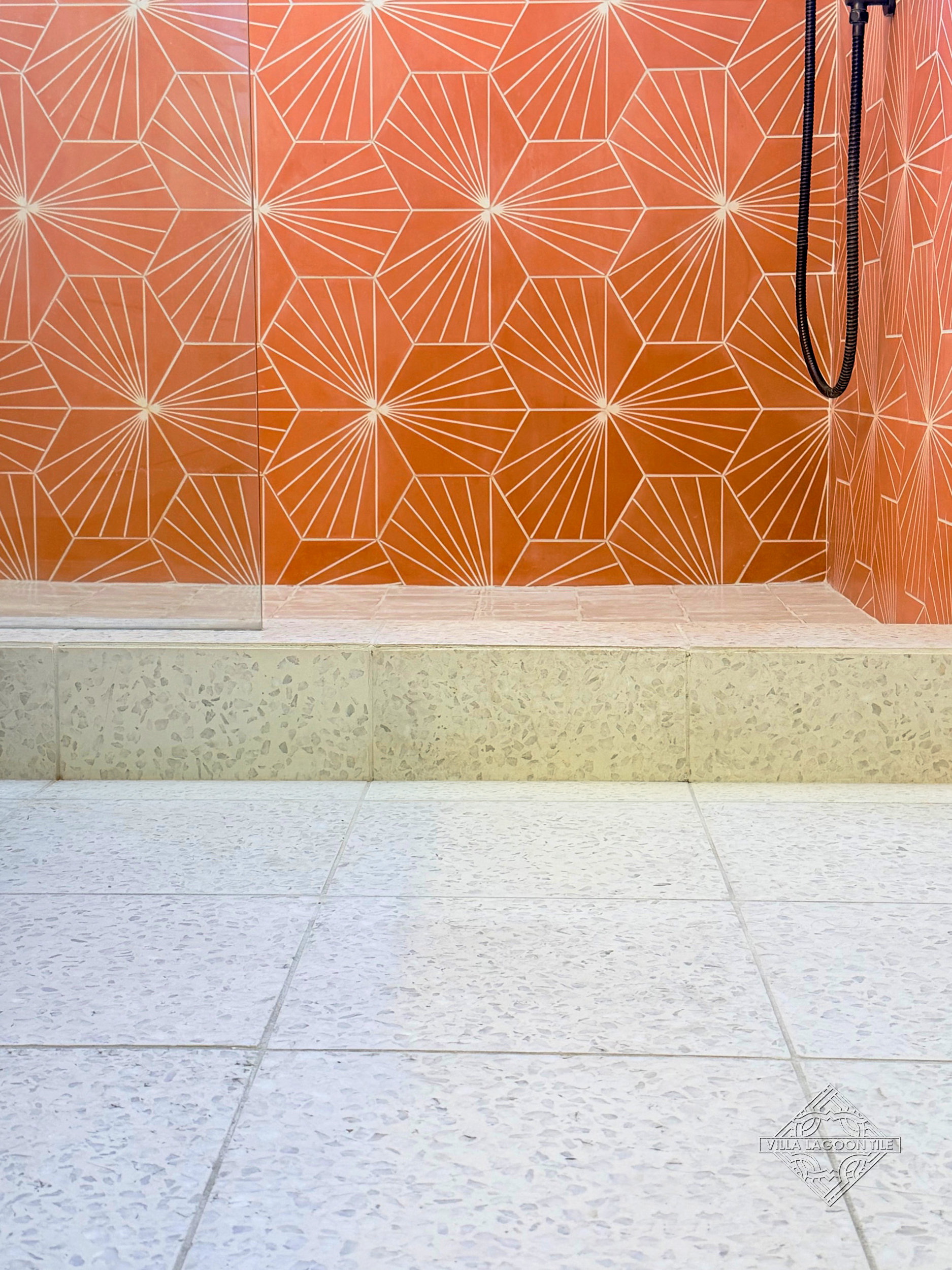 Architectural Shower Curb Detail with Large Dew Drop Terrazzo and Tangerine Cement Tile
