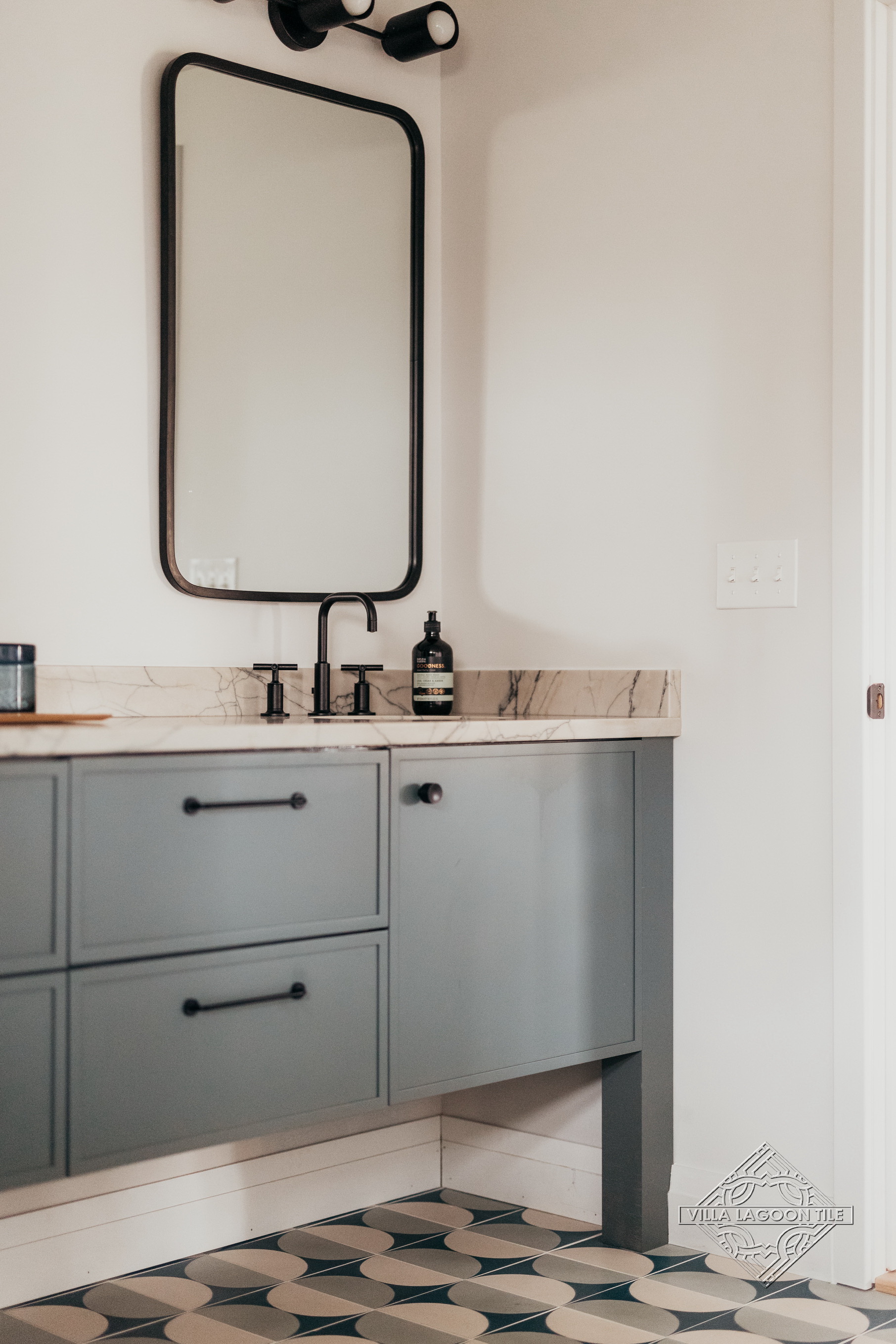Modern Bathroom Vanity with Custom Geometric Cement Tile Flooring