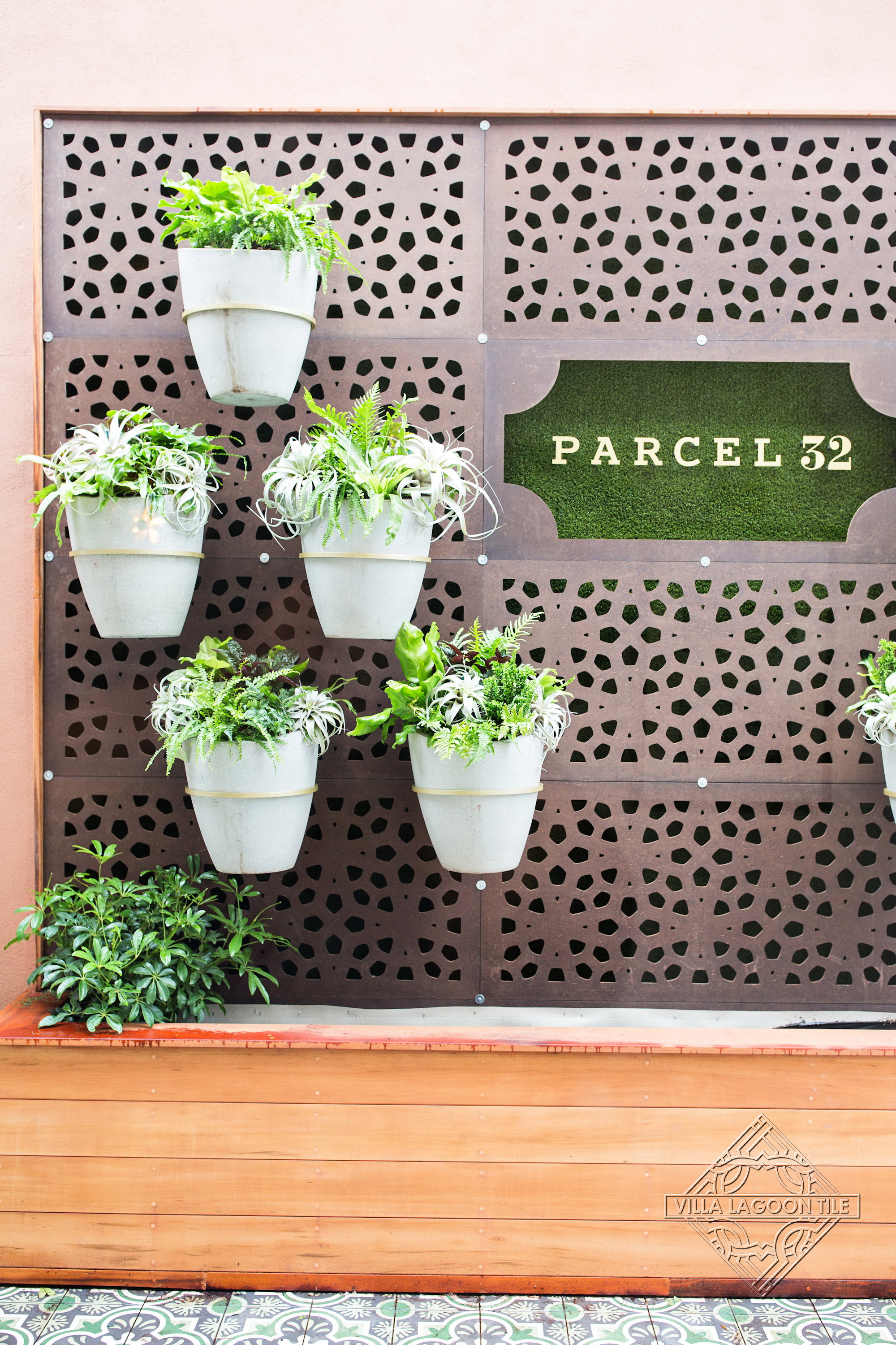 Parcel 32 Outdoor Signage: Custom Vertical Living Wall and Patterned Encaustic Cement Tile Flooring in Charleston, SC