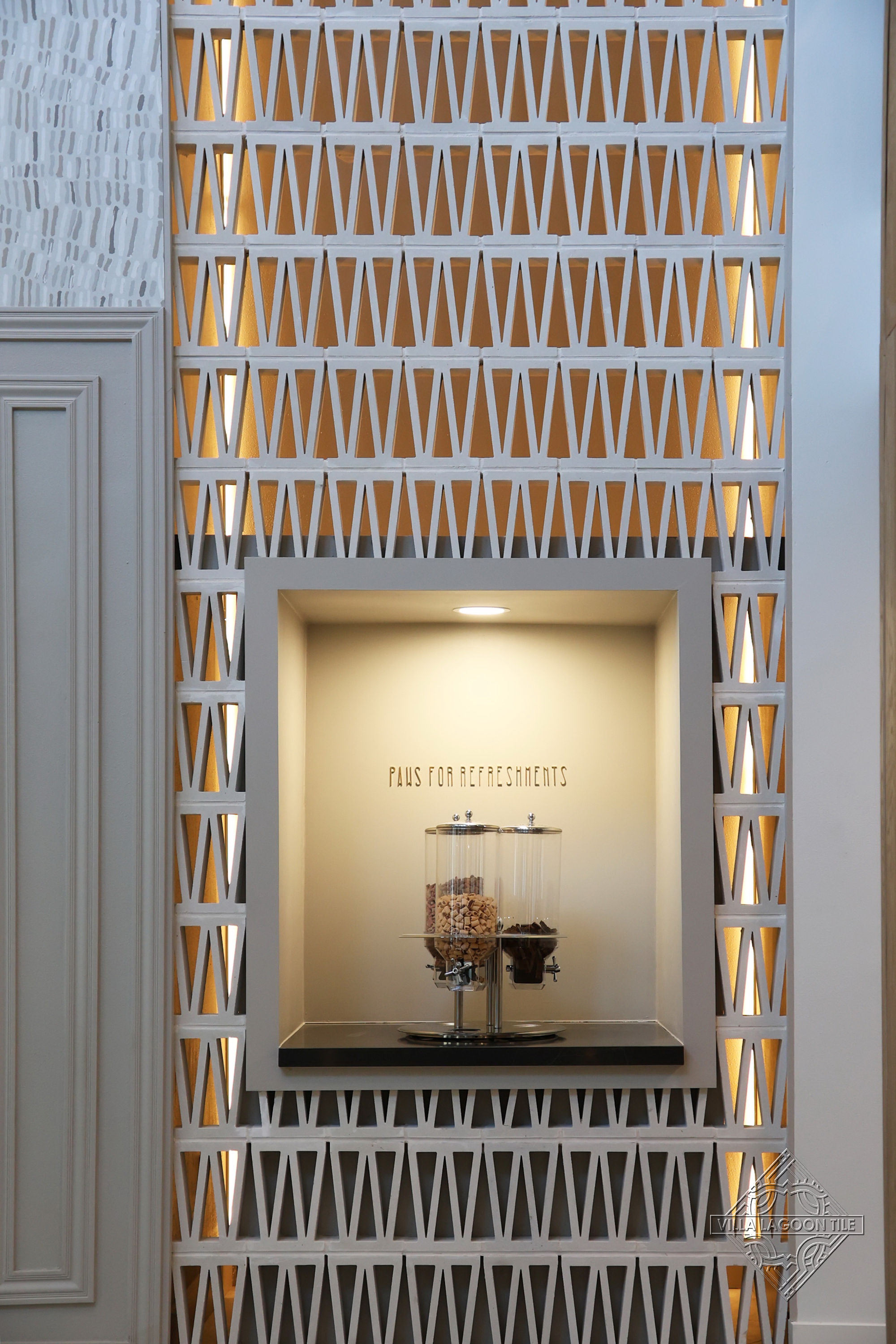 Integrated Refreshment Station in Backlit Geometric Breeze Block Wall | Luxury Apartment Amenities