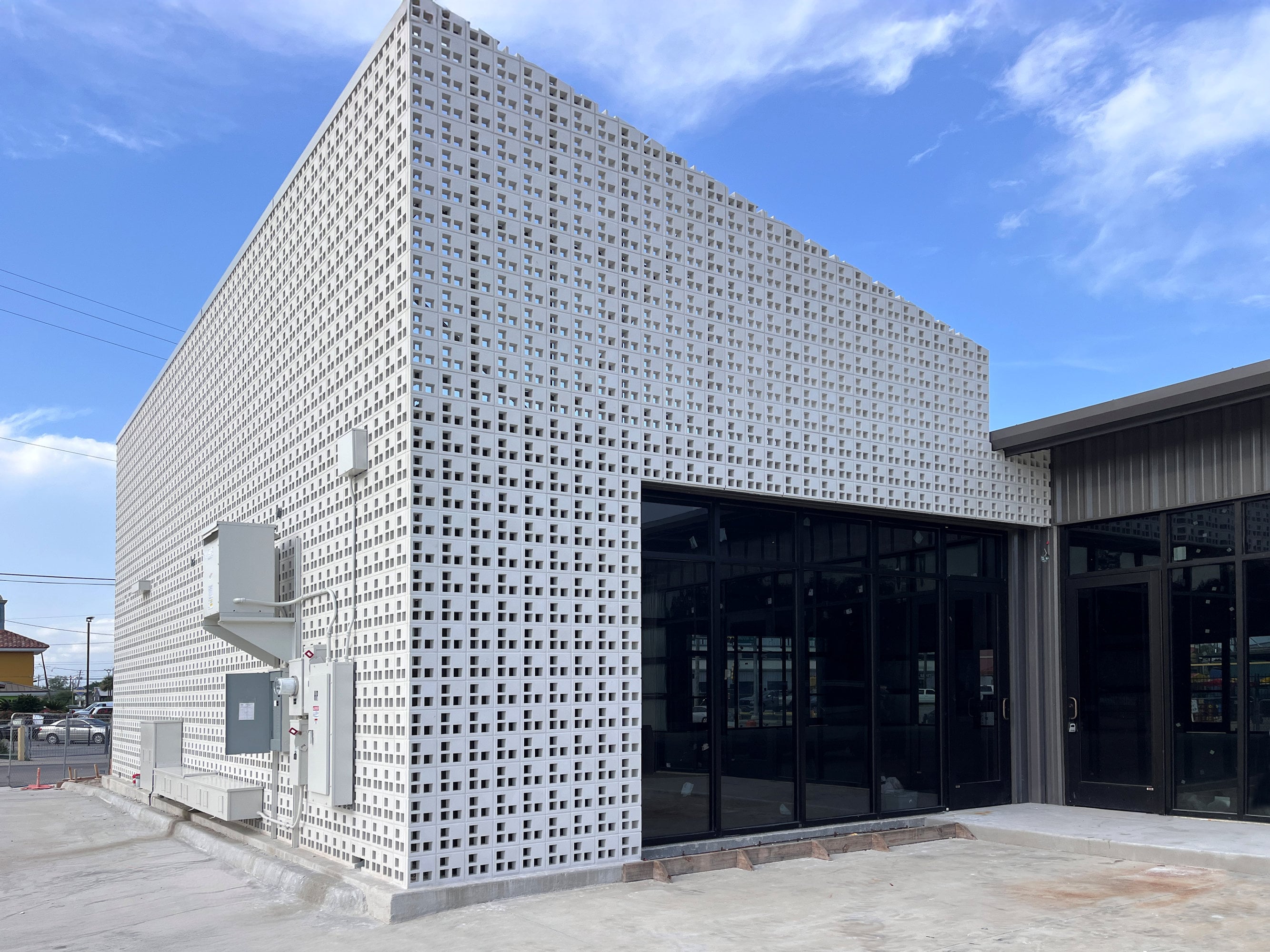 Modern Retail Facade with Antigua Breeze Block Screen - F2M Houston Shops