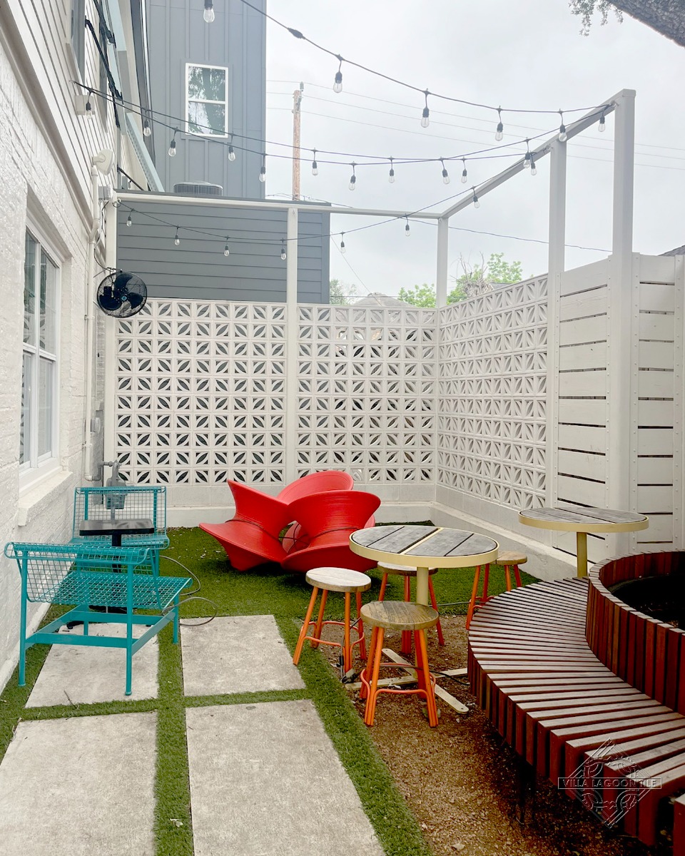 Outdoor Commercial Patio Design with White Decorative Breeze Block Walls and Modern Seating