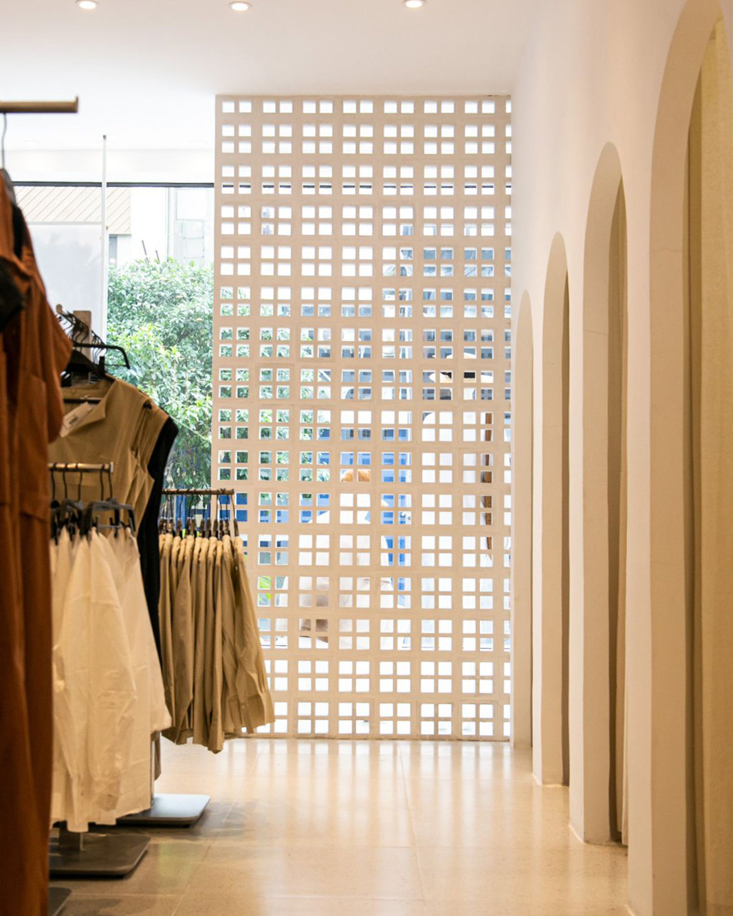 Modern Retail Interior Design: Arched Details and Decorative Breeze Block Partition
