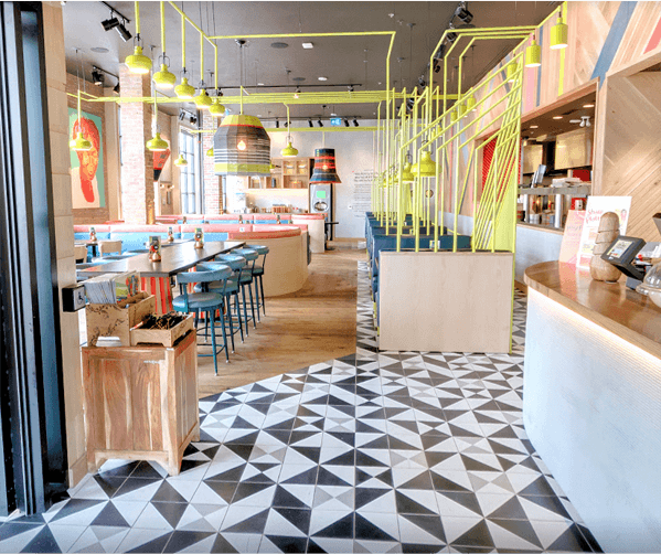 Geometric black, white, and gray cement tile restaurant floor, by Villa Lagoon Tile.