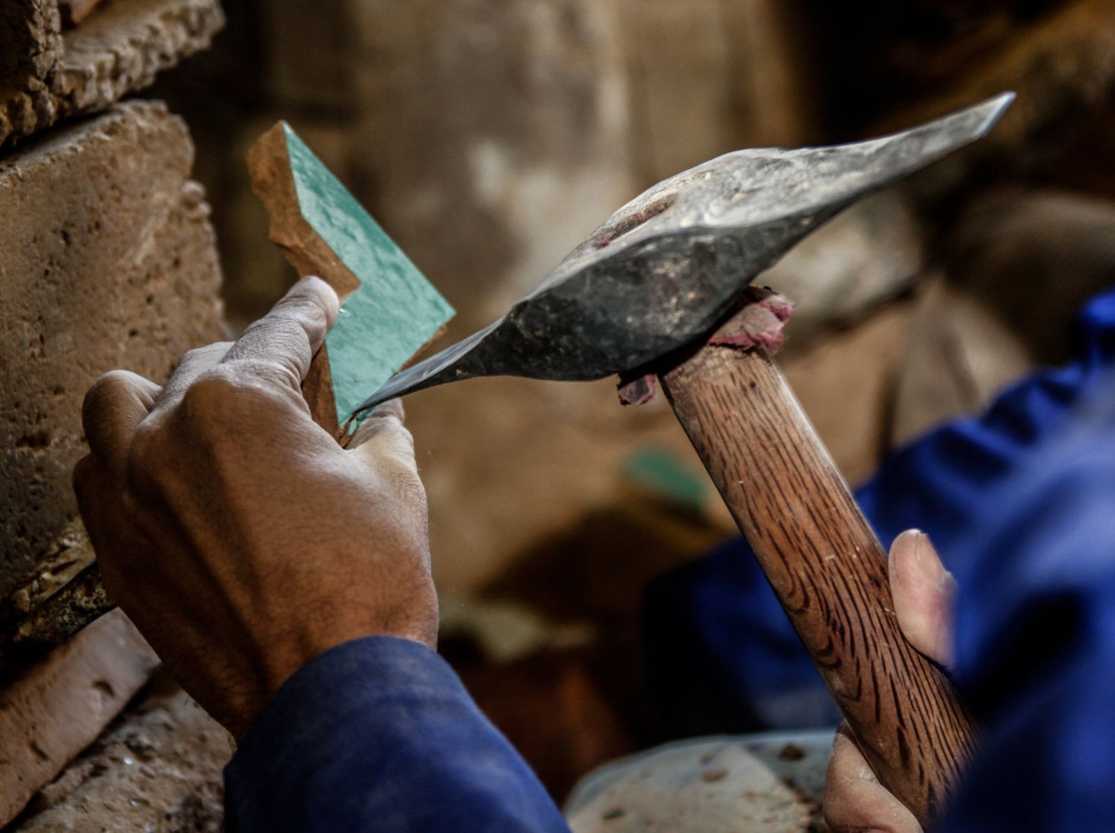 Villa Lagoon Tile hand-made Moroccan zellige being shaped by an artisan.